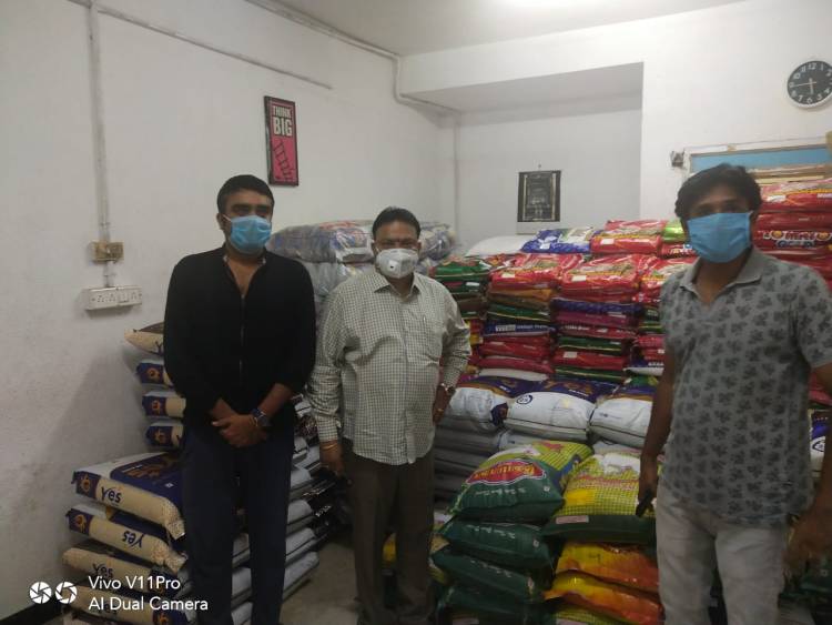 Film producer of vels film international Ishari k Ganesh contributing rice bags 
